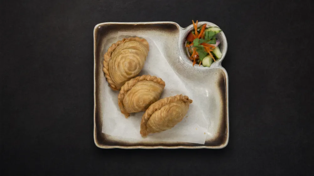 Thai Bistro curry puffs with cucumber and carrot relish