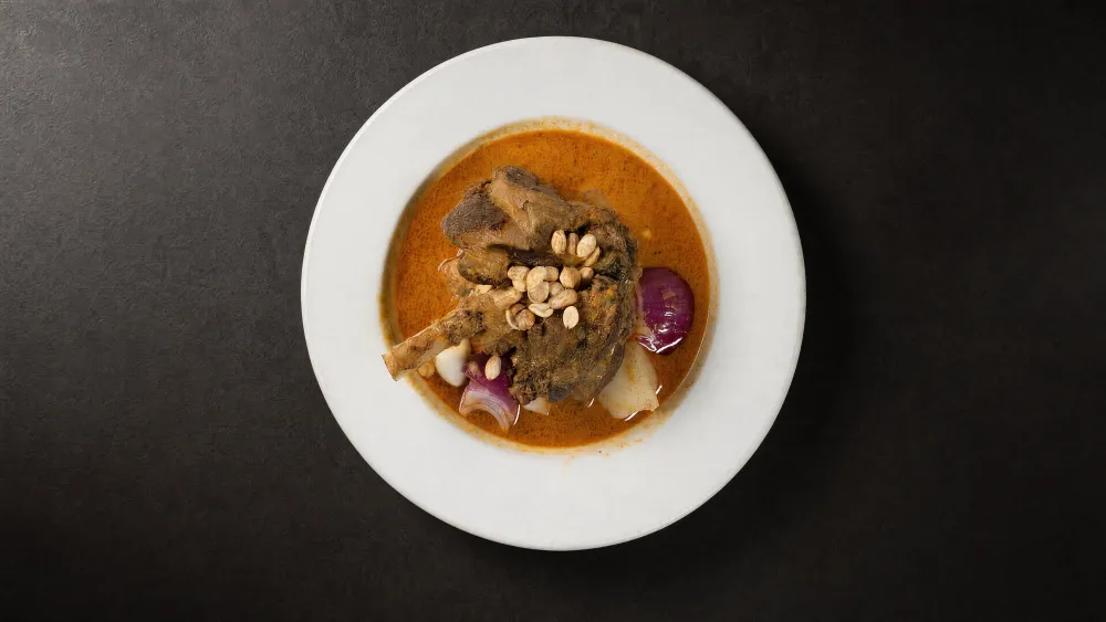 Thai Bistro Massaman curry with braised meat, potato, red onion and peanuts